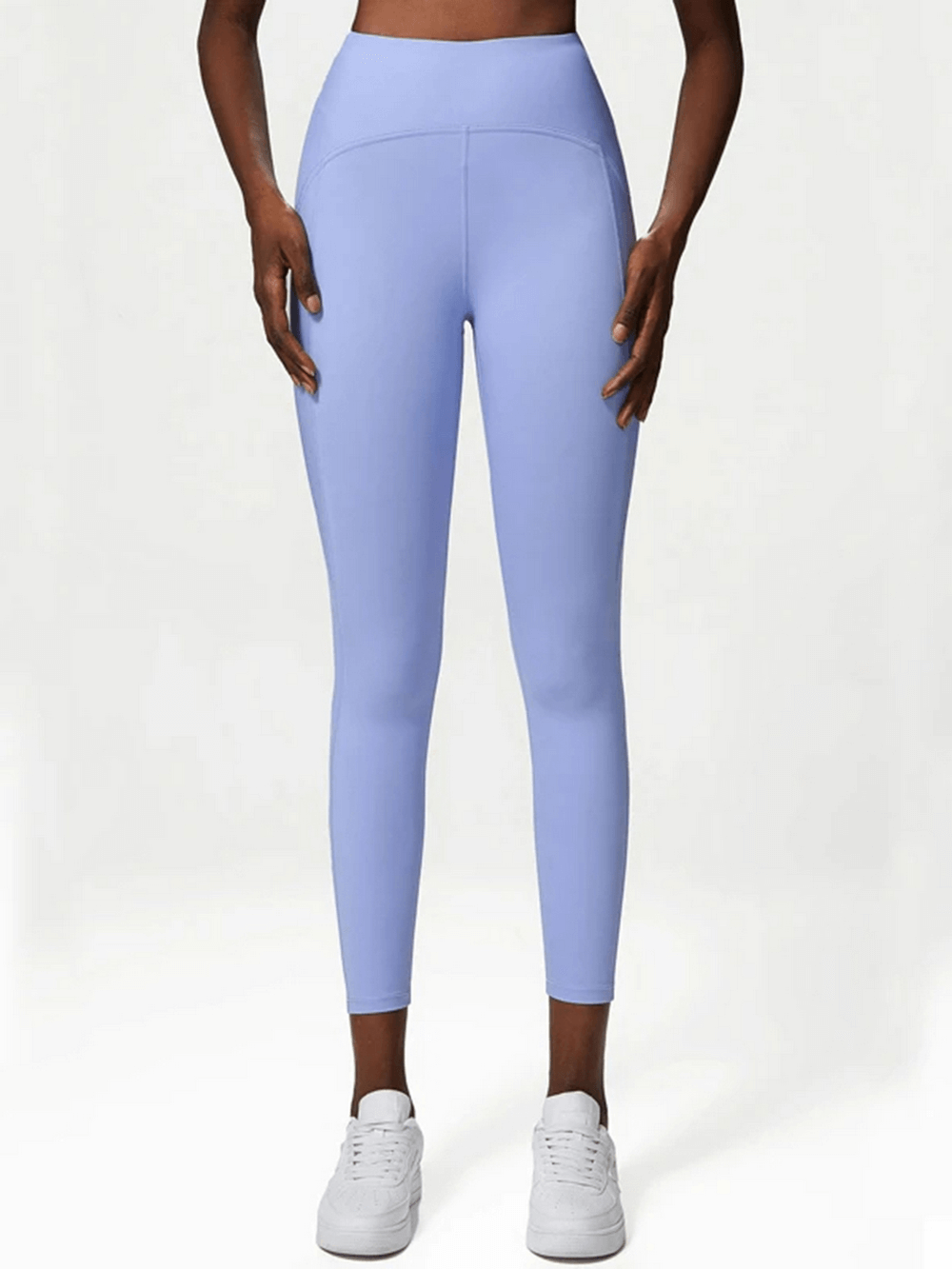 Light blue women's stylish yoga leggings SF2100, versatile for gym, dance, and running, featuring elastic waistband and nylon-spandex blend.